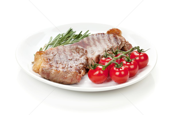 Sığır filetosu biftek biberiye kiraz domates plaka yalıtılmış Stok fotoğraf © karandaev