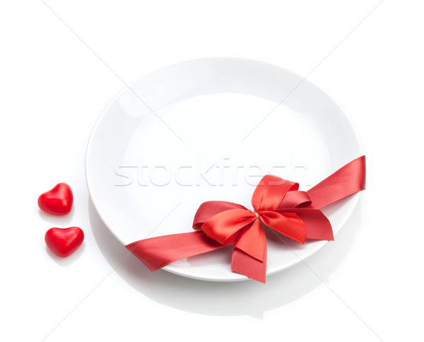 Valentine's Day heart shaped candy and plate with red bow Stock photo © karandaev