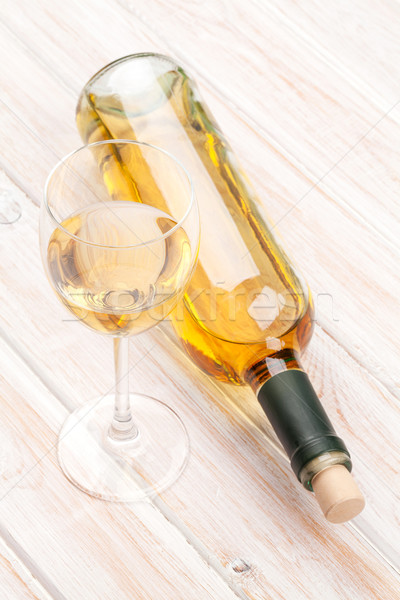 White wine glass and bottle Stock photo © karandaev