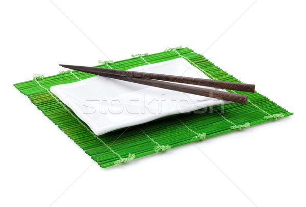 Chopsticks and plate Stock photo © karandaev