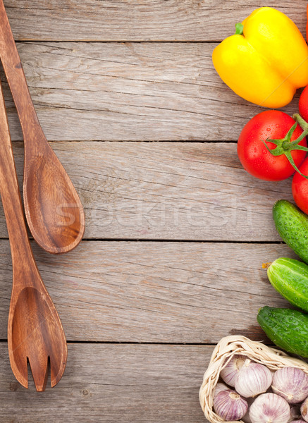 Fresh ripe vegetables and utensils on wooden table Stock photo © karandaev