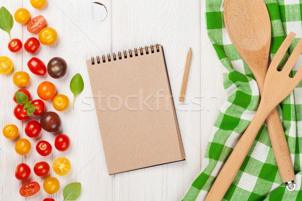 Colorful cherry tomatoes and kitchen utensils Stock photo © karandaev
