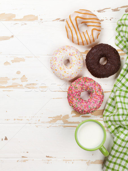 [[stock_photo]]: Lait · donuts · table · en · bois · haut · vue · espace · de · copie