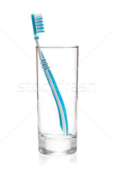 Blue tooth brush in glass Stock photo © karandaev