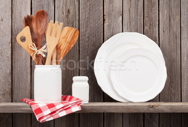 Kitchen cooking utensils on shelf Stock photo © karandaev
