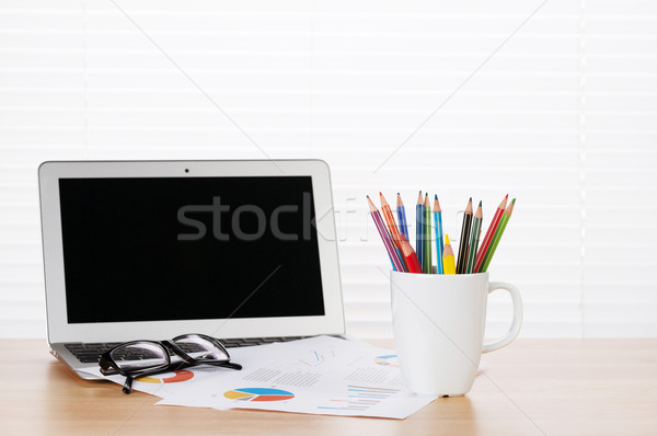 Office workplace with laptop, reports and pencils Stock photo © karandaev
