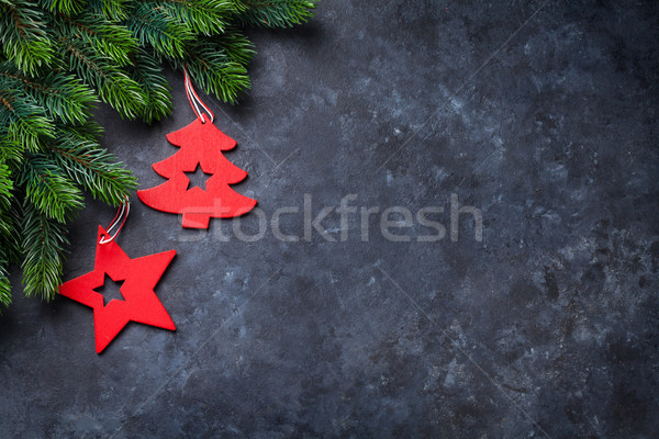 Christmas fir tree and decor over stone background Stock photo © karandaev