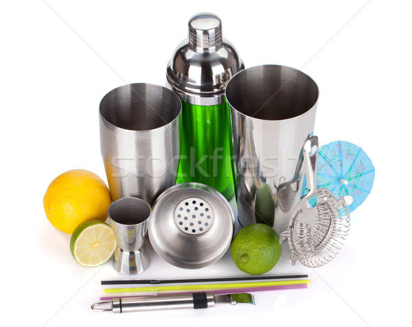 Cocktail shaker, strainer, measuring cup, drinking straws and ci Stock photo © karandaev