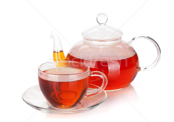 Glass cup and teapot of black tea Stock photo © karandaev