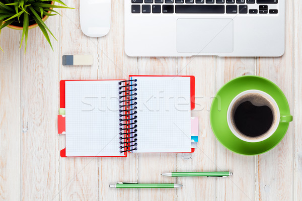 Stock photo: Office desk table with computer, supplies, coffee cup and flower