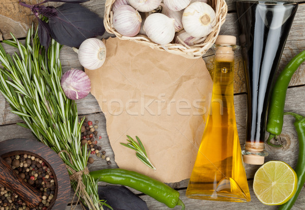 Gyógynövények fűszer öntet kellékek fa asztal papír Stock fotó © karandaev