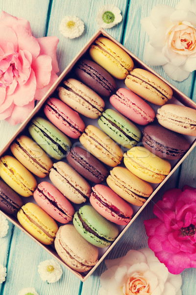Colorful macaroons in a gift box and roses Stock photo © karandaev