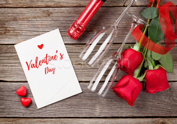Red roses with Valentines day card and champagne Stock photo © karandaev