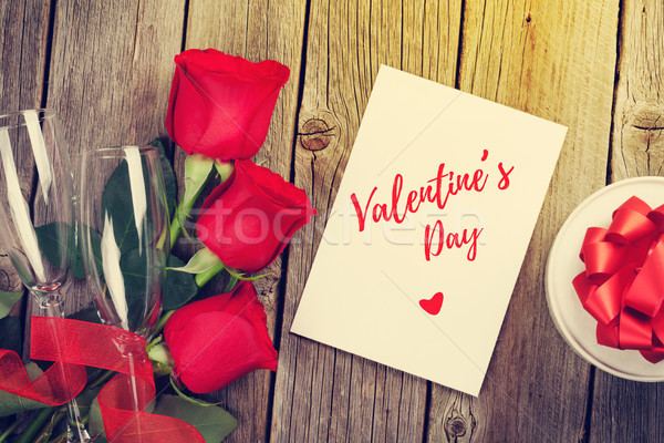 Valentines day greeting card, gift box and red roses Stock photo © karandaev