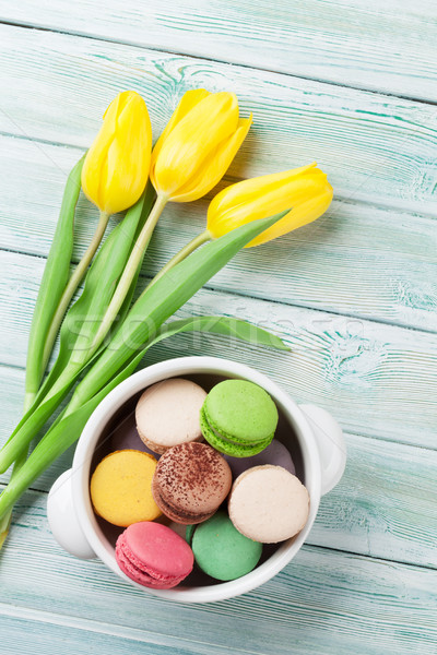 Colorful macaroons and yellow tulips Stock photo © karandaev