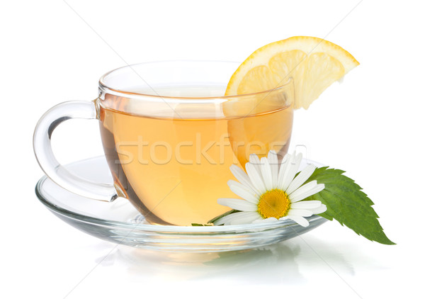 Cup of tea with lemon slice, mint leaves and chamomile flower Stock photo © karandaev