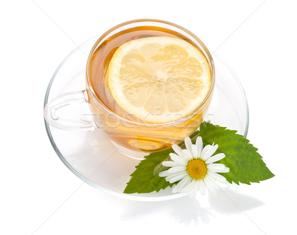 Stock photo: Cup of tea with lemon slice, mint leaves and chamomile flower