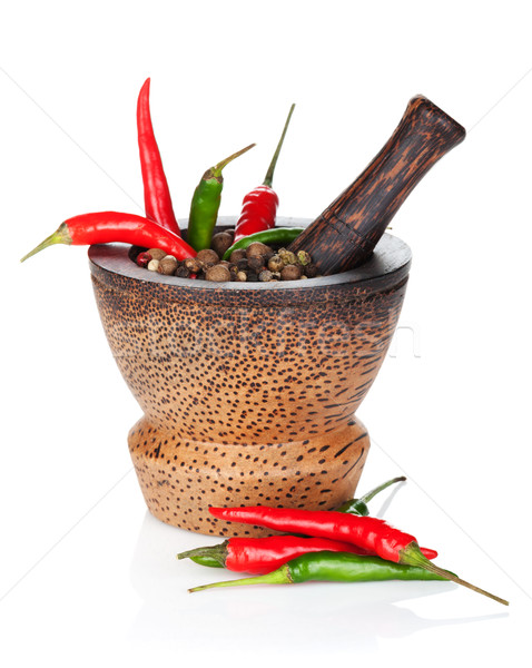 Stock photo: Mortar and pestle with red hot chili pepper and peppercorn