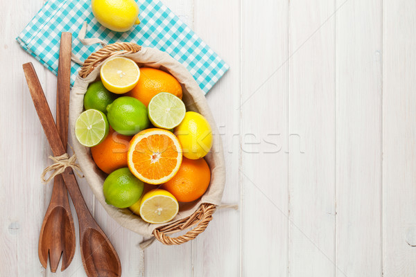 Citrus fruits in basket. Oranges, limes and lemons Stock photo © karandaev