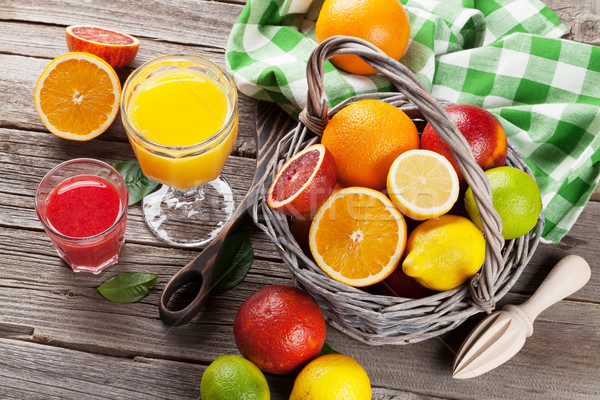 Fresh ripe citruses and juice. Lemons, limes and oranges Stock photo © karandaev