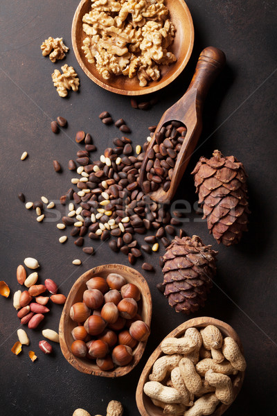 Various nuts on stone table Stock photo © karandaev