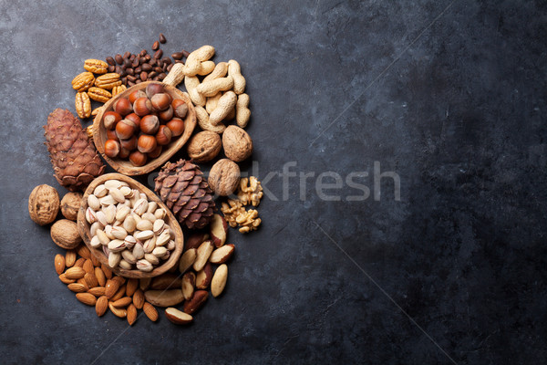 Stock photo: Various nuts on stone table