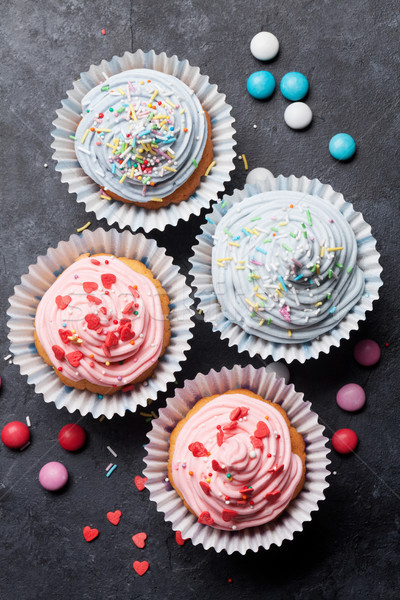 Sweet cupcakes with colorful decor Stock photo © karandaev