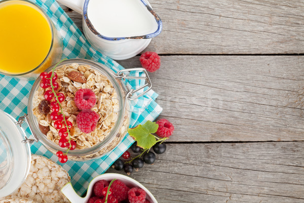 Healty breakfast with muesli, berries and orange juice Stock photo © karandaev