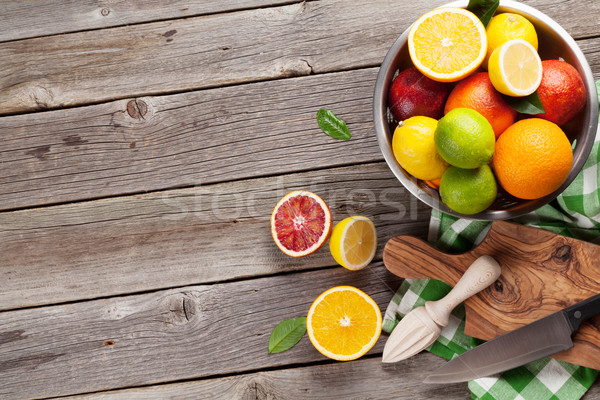Fresh citrus fruits in colander Stock photo © karandaev