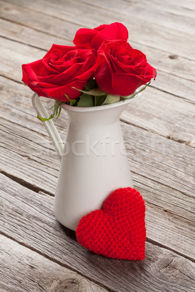Red rose flowers in pitcher and Valentines day heart Stock photo © karandaev