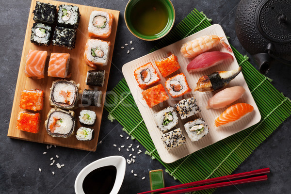 Set of sushi and maki roll and green tea Stock photo © karandaev