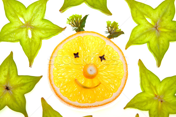 Stock photo: Starfruit (carambola) slices with orange face