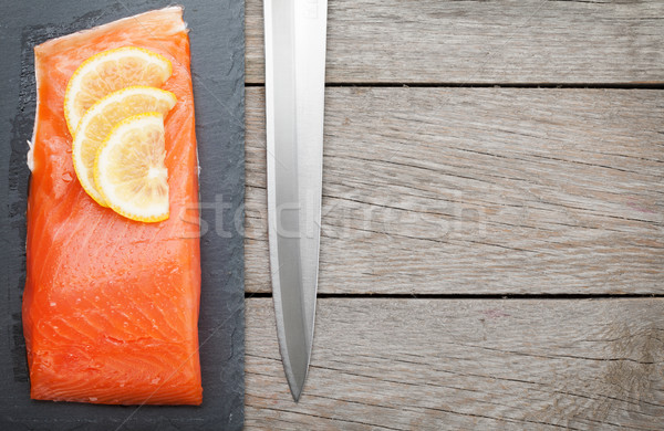 Fresh salmon fish with lemon and japan knife Stock photo © karandaev