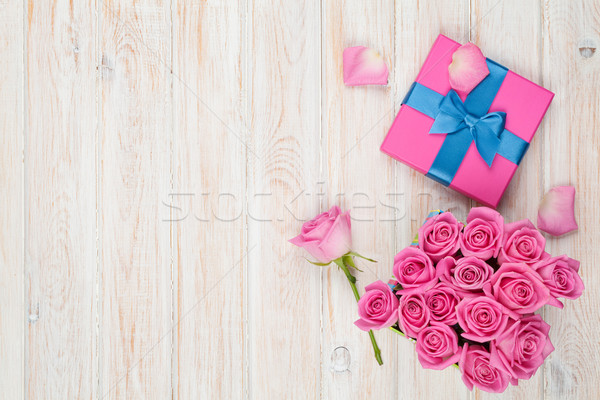 Valentines day background with gift box full of pink roses Stock photo © karandaev