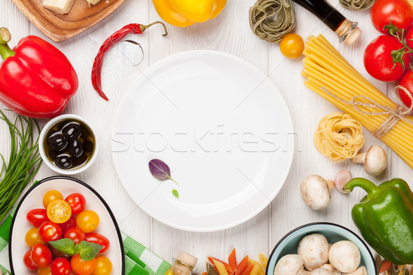 Italian food cooking ingredients. Pasta, vegetables, spices Stock photo © karandaev