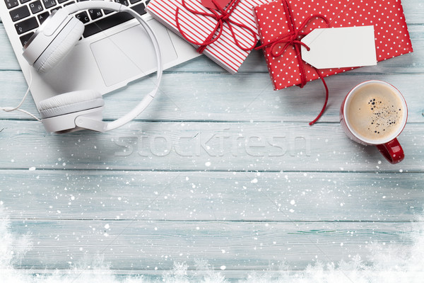 Christmas Gift Boxes Pc And Coffee Cup On Wood Stock Photo