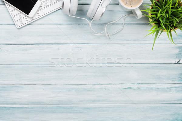 Headphones, phone and pc on wooden desk table Stock photo © karandaev