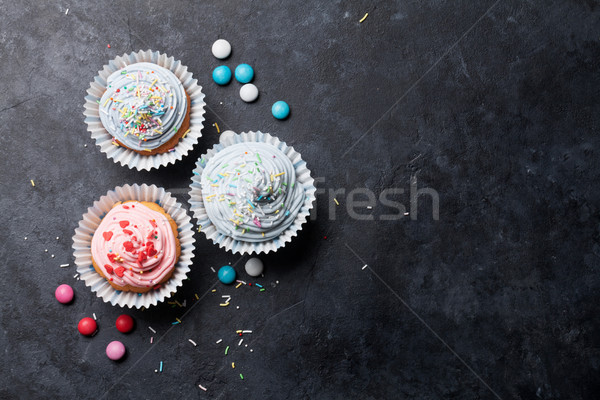 Sweet cupcakes with colorful decor Stock photo © karandaev