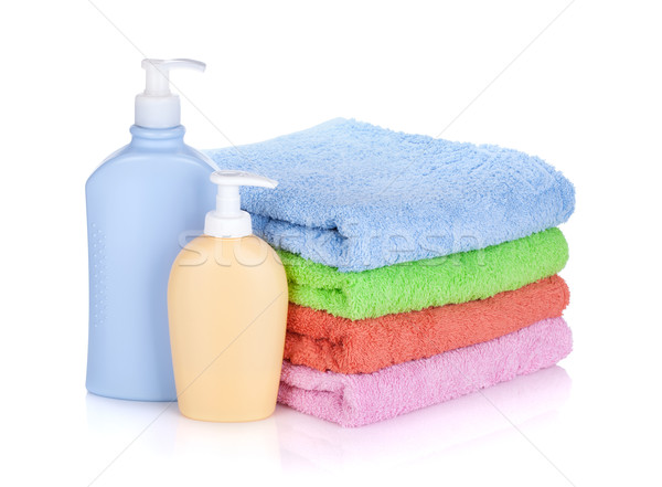 Cosmetics bottles and towels Stock photo © karandaev