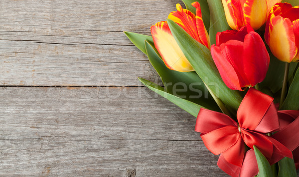 Fresh colorful tulips bouquet with ribbon and bow Stock photo © karandaev