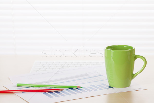 Stock photo: Office workplace with coffee, supplies and reports