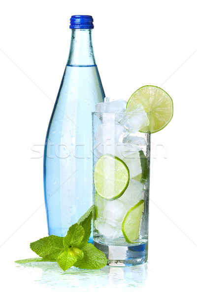 Stock photo: Glass of water with lime and ice