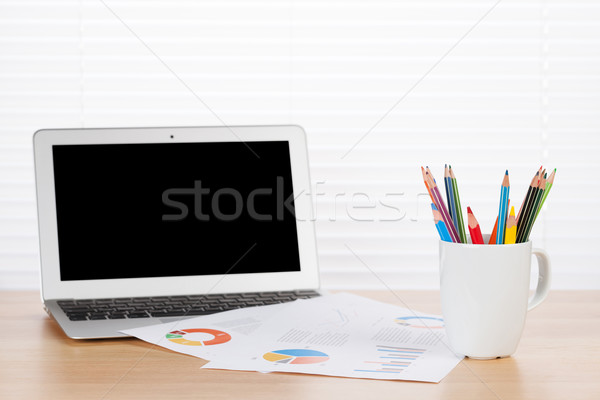 Office desk workplace with laptop, reports and pencils Stock photo © karandaev