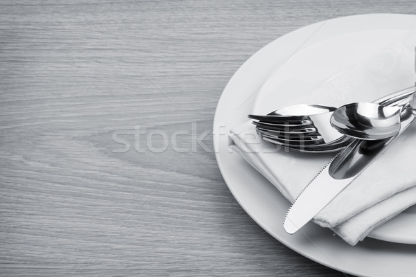 Silverware or flatware set of fork, spoons and knife on plate Stock photo © karandaev