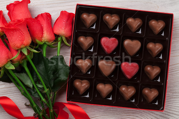 Valentines day with red roses and chocolate Stock photo © karandaev