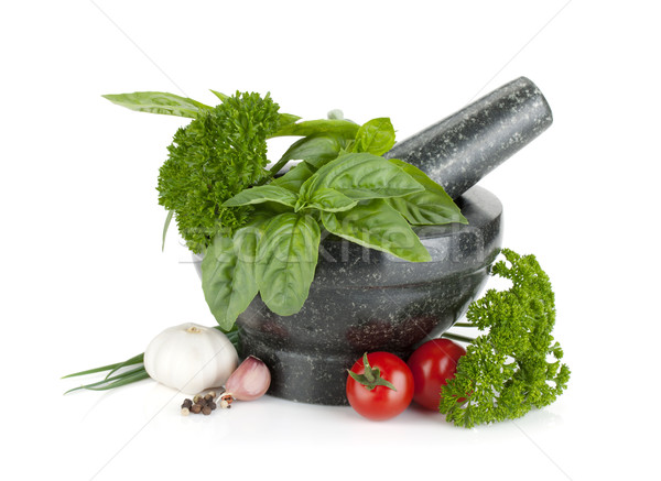 Fresh flavoring herbs and spices in mortar Stock photo © karandaev
