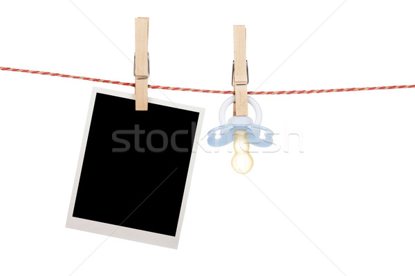 Instant photo and pacifier hanging on the clothesline Stock photo © karandaev