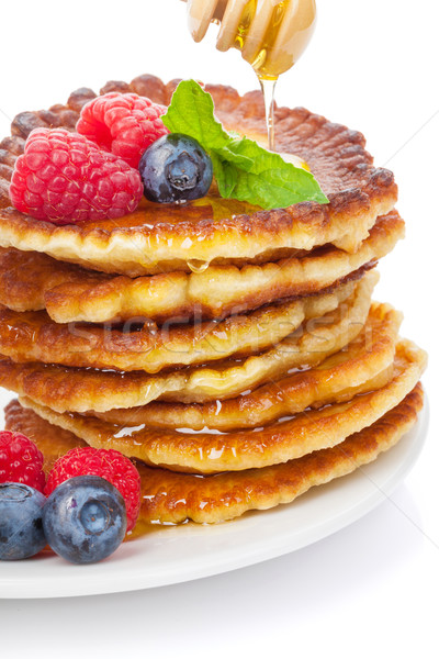 Stock photo: Pancakes with raspberry, blueberry, mint and honey syrup