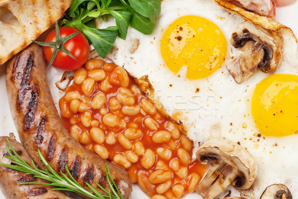 English breakfast. Fried eggs, sausages, bacon Stock photo © karandaev