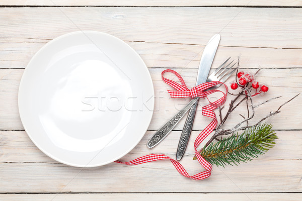 Empty plate, silverware and christmas decor Stock photo © karandaev